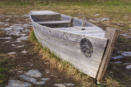 Abandoned Wooden Boat on Land photo