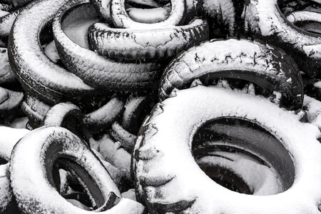 Pile of Old Tires Covered with Snow