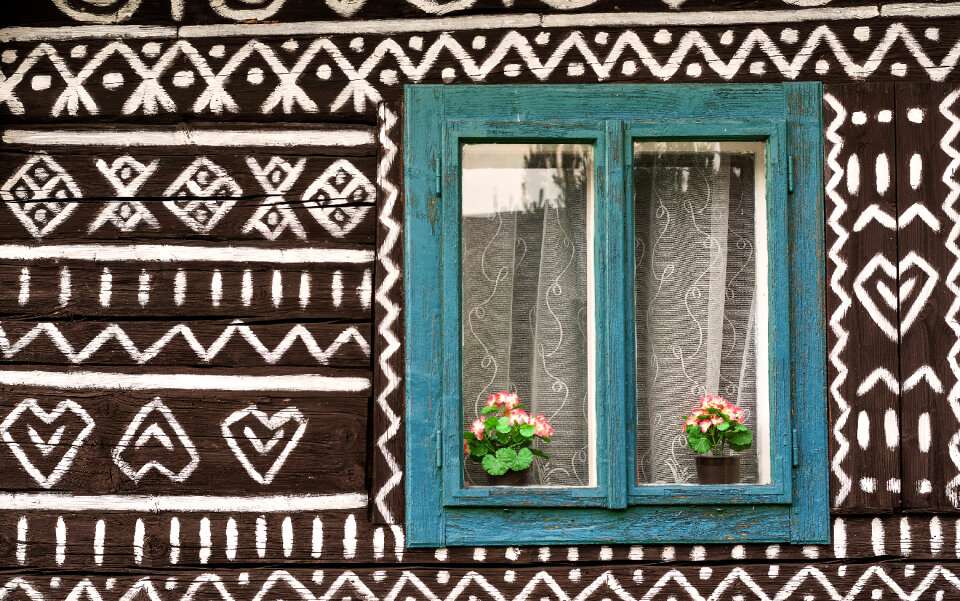 Blue Window on a Painted Wooden House