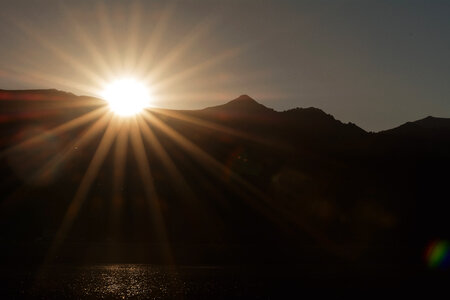 Sunset Sun Rays Over Mountains photo