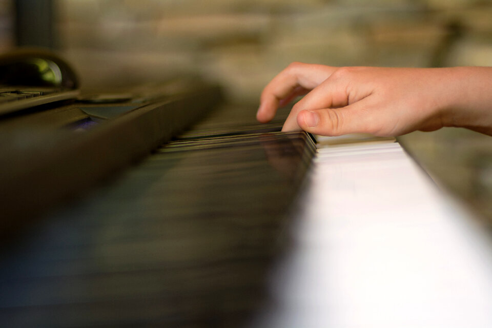 Children’s Hands Are Playing The Piano