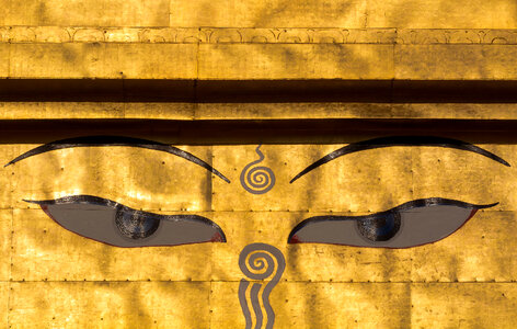 Eyes of the Buddha on the Golden Stupa photo