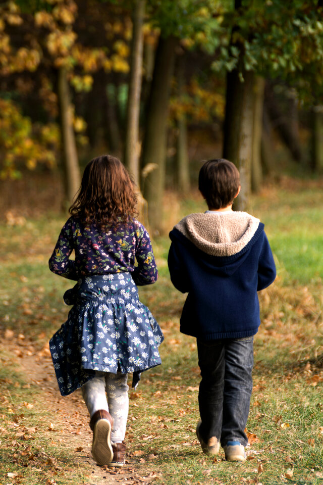 Boy and girl siblings in the woods
