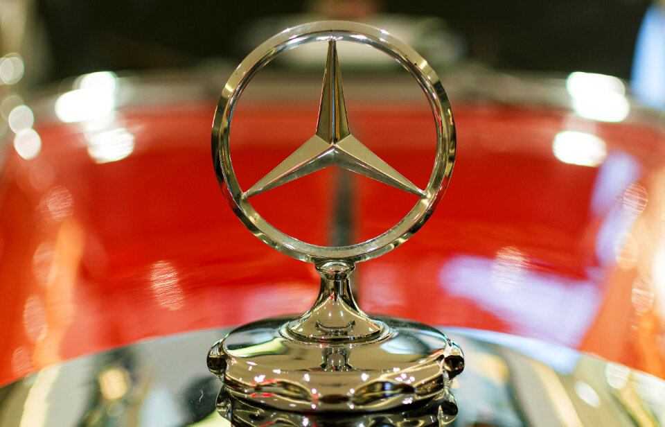 The Mercedes-Benz logo on a classic car