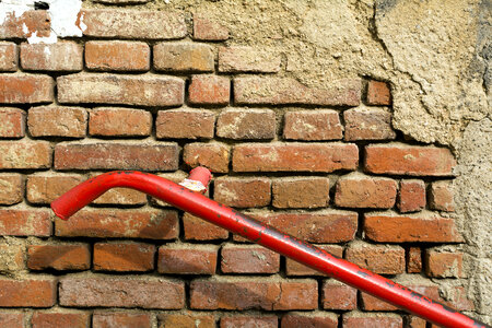 Old Brick Wall With Red Handrail