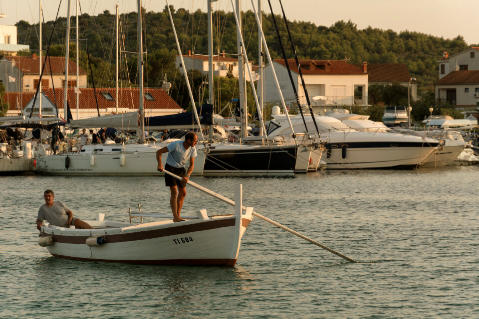 Two Men on Wooden Boat in Croatia photo