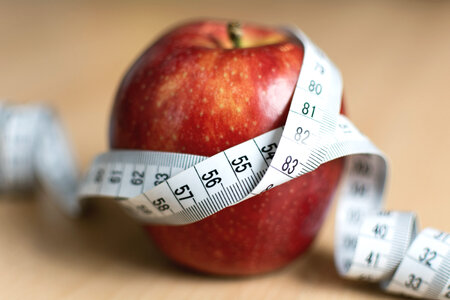 Diet Concept – Red Apple And Tape Measure photo