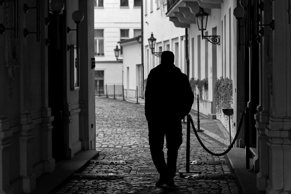 Silhouette of Lonely Man on the Street photo