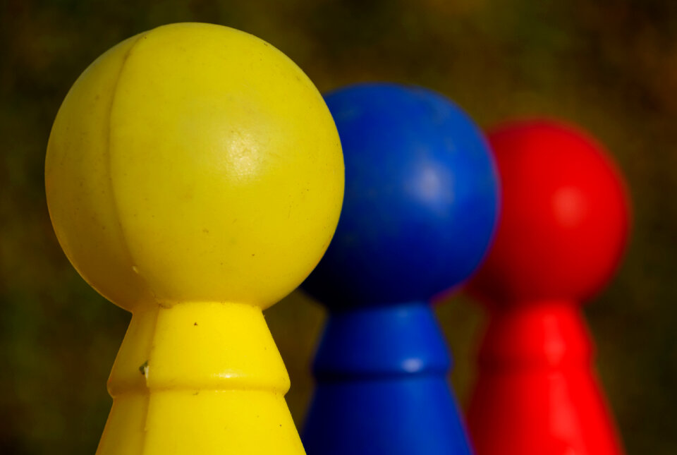 Three Colored Plastic Skittles