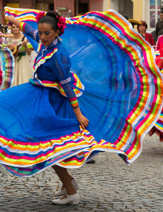 Dancing woman in traditional mexican dress photo