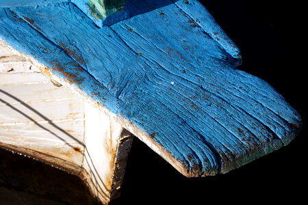 White and blue wooden boat with wood texture photo