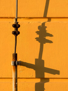 Lightning Rod Shadow On Yellow Wall photo