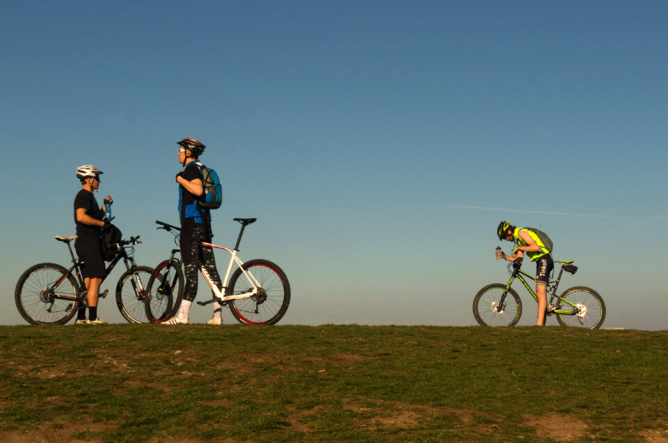 Three Bikers On The Top The Hill