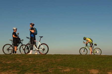 Three Bikers On The Top The Hill photo