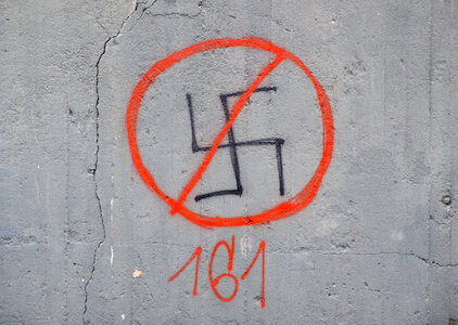 Crossed-Out Swastika On A Wall
