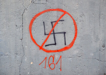 Crossed-Out Swastika On A Wall photo