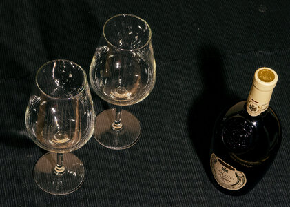 Two Glasses And Bottle Of Red Wine On Black Background photo