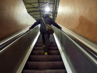 Man On Escalator In Tube photo