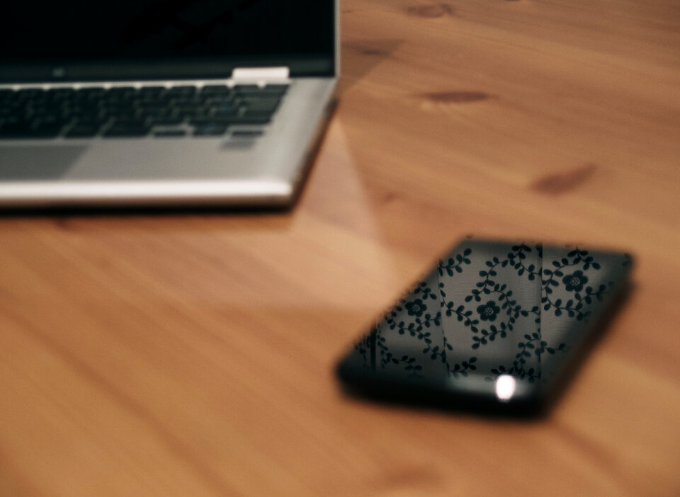 Laptop And Smartphone On Wooden Table
