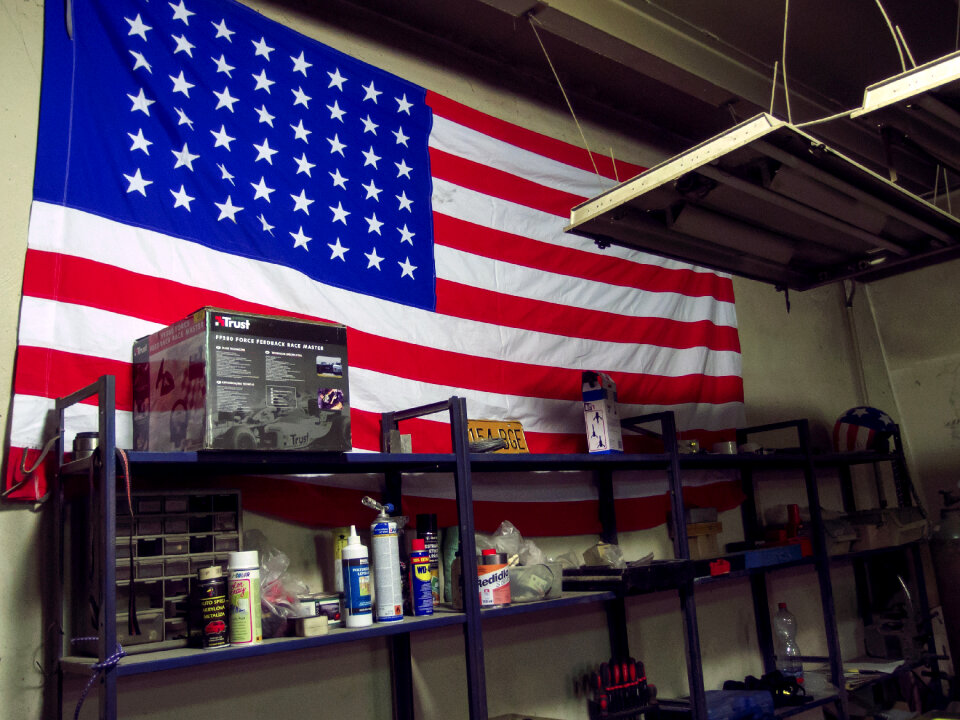 American Flag On The Wall Of Car Repair Shop