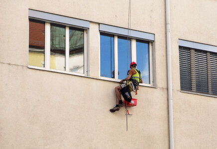 Window washer on a climbing rope photo
