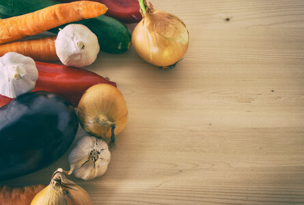 Vegetables on wooden cutting board photo