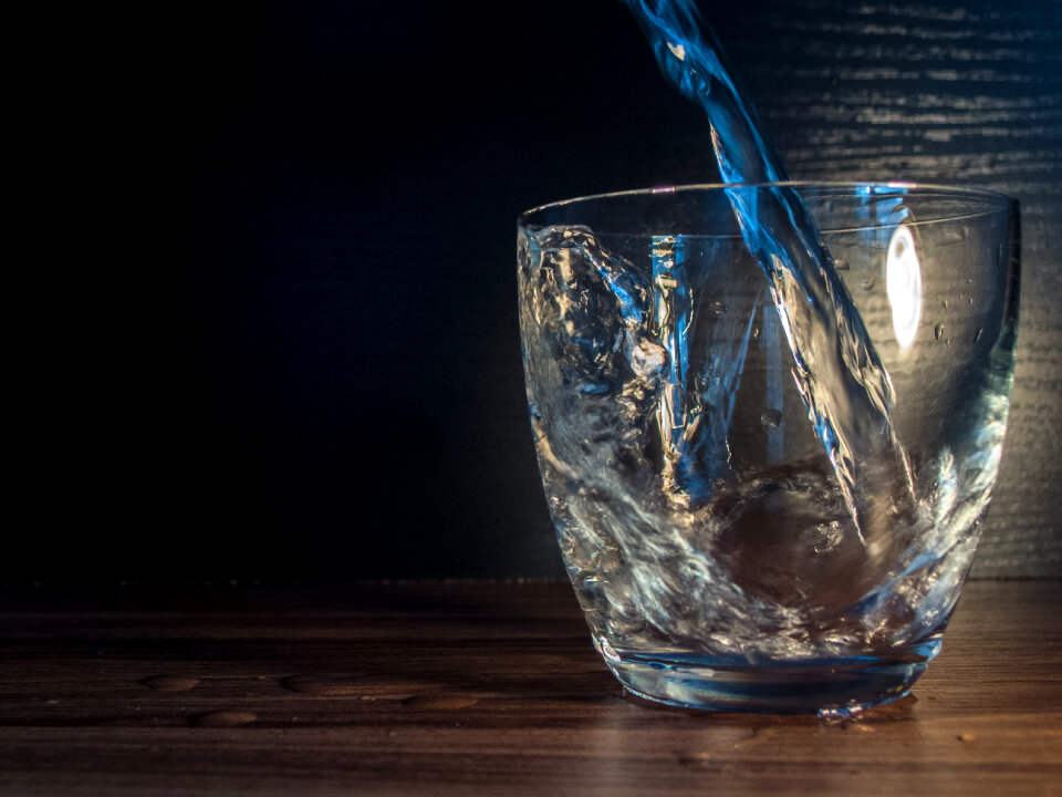 Water is poured into the glass