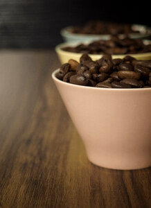 Coffee beans in small cups photo