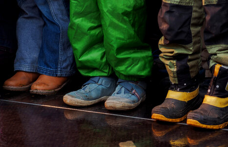 Three children standing – shoes and feet photo