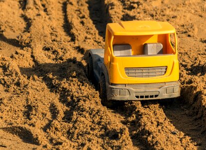 Plastic toy car on the playground