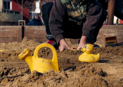 Young boy in the sandbox photo