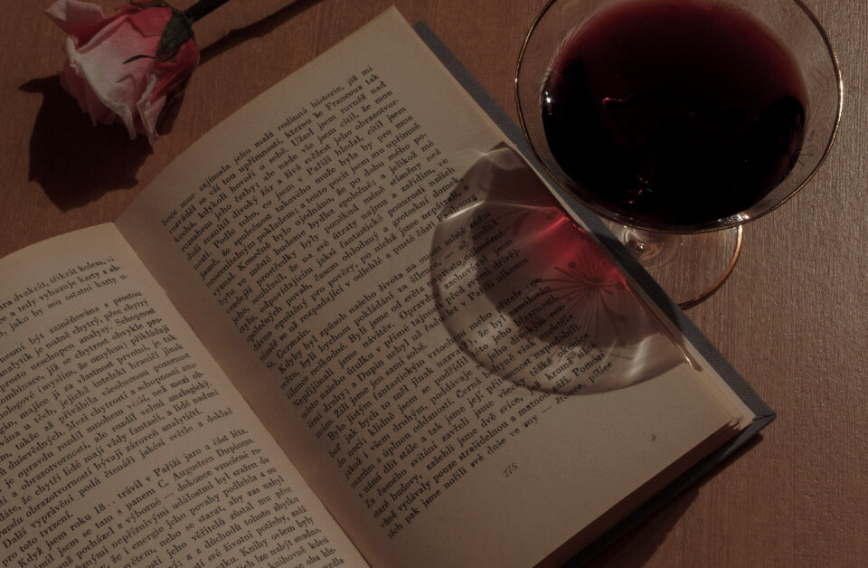Book, wine and rose