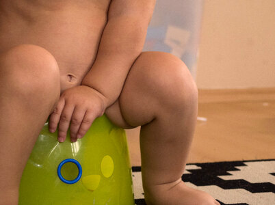 Baby sitting on potty