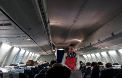 Flight attendant in aircraft photo