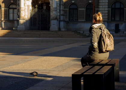 Waiting woman with a pigeon photo