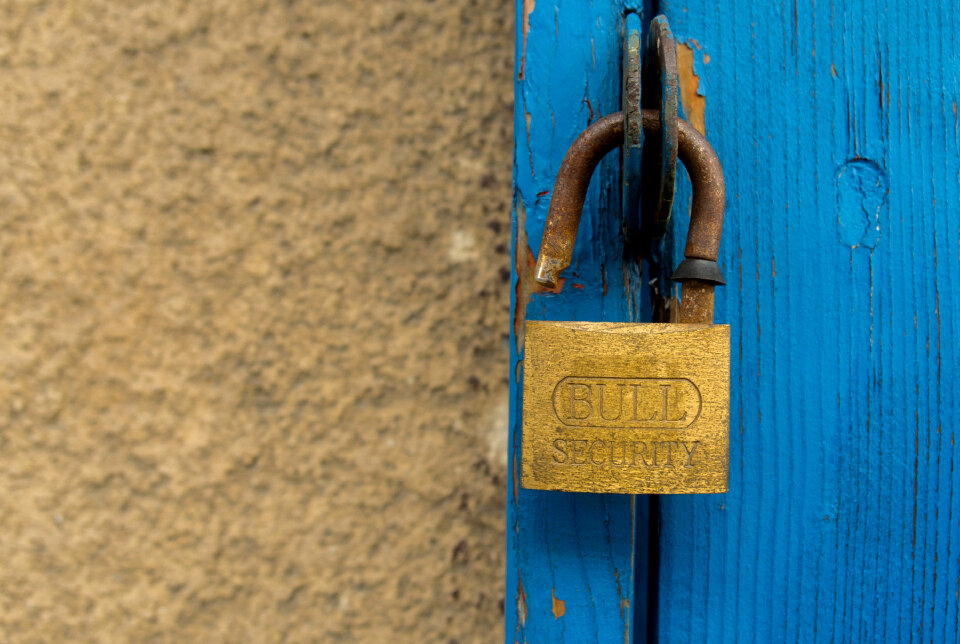 Old door and an open padlock