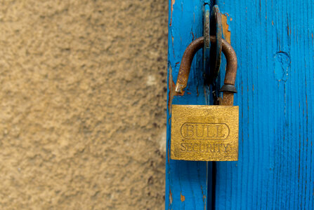 Old door and an open padlock