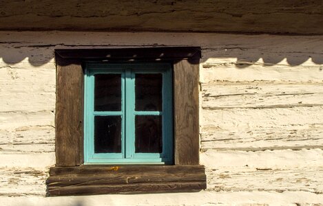 Blue window of an old house photo