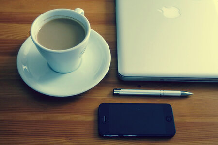 Coffee, iPhone and Laptop photo