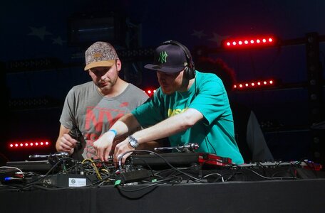 2 DJ behind the mixer photo