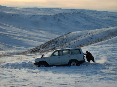 Car sunk in snow – Mongolia photo