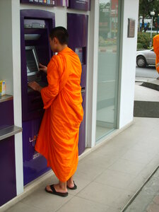 Buddhist monk and ATM photo
