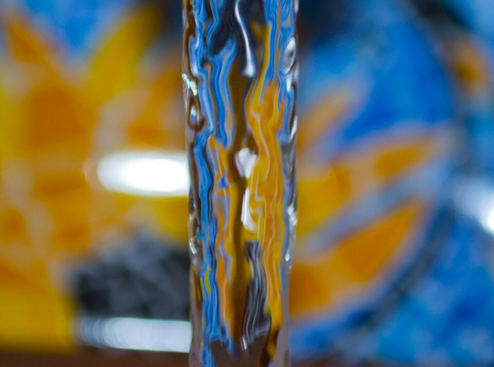 Water flow by blue and yellow tile photo