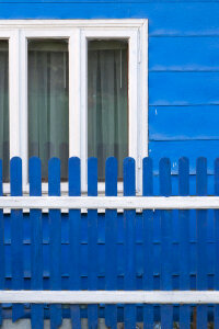 Blue and white house and fence