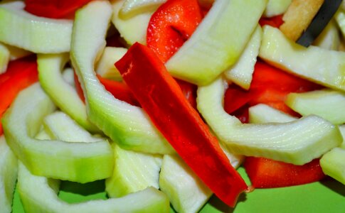 Sliced squash and red bell pepper photo