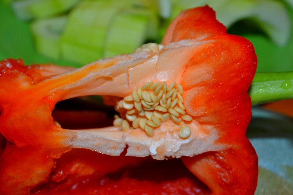 Seeds on sliced red bell pepper