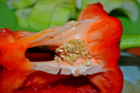 Seeds on sliced red bell pepper photo