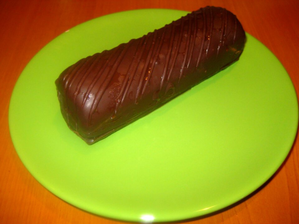 Chocolate cake on green plate