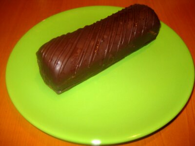 Chocolate cake on green plate