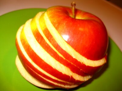 Sliced apple on green plate
